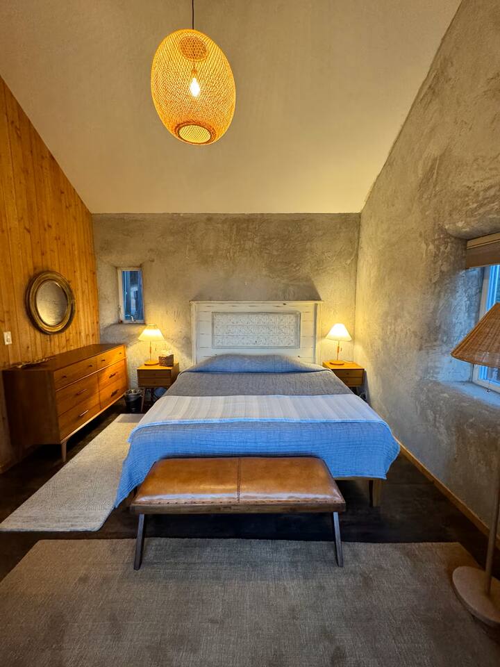 Cozy bedroom with warm wood accents.