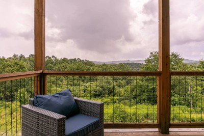 Savor the view from the cozy outdoor chair on the deck. Sip your morning coffee or evening wine while gazing at the lush mountains and New River valley—just minutes from Boone and Blowing Rock.
