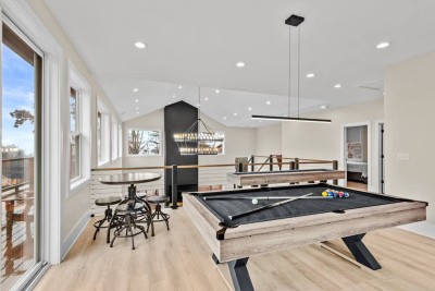 Gather in the bright game room for friendly rounds of pool or shuffleboard. Large windows and patio doors open to mountain views, while cozy seating invites spectators – a perfect indoor hangout after adventures in Boone, Blowing Rock and Deep Gap.