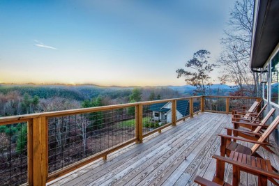 Stroll along the expansive deck as the sun sets over the Blue Ridge. Relax in the Adirondack chairs overlooking the green mountains and New River valley after days exploring Boone and Blowing Rock.