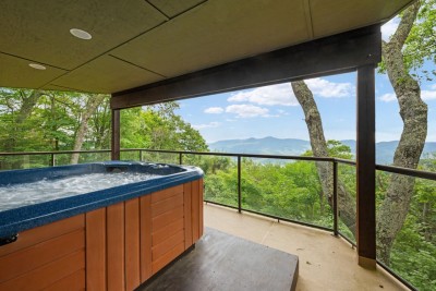 Soak in the steaming hot tub while gazing at endless mountain vistas. The covered deck lets you unwind rain or shine after days spent skiing, hiking or biking around Beech Mountain.