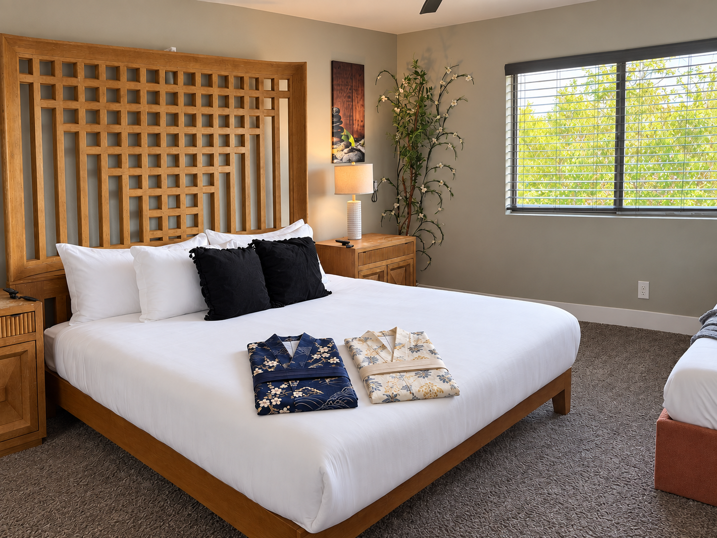 Bright, serene bedroom with plush king bed and stylish wood details