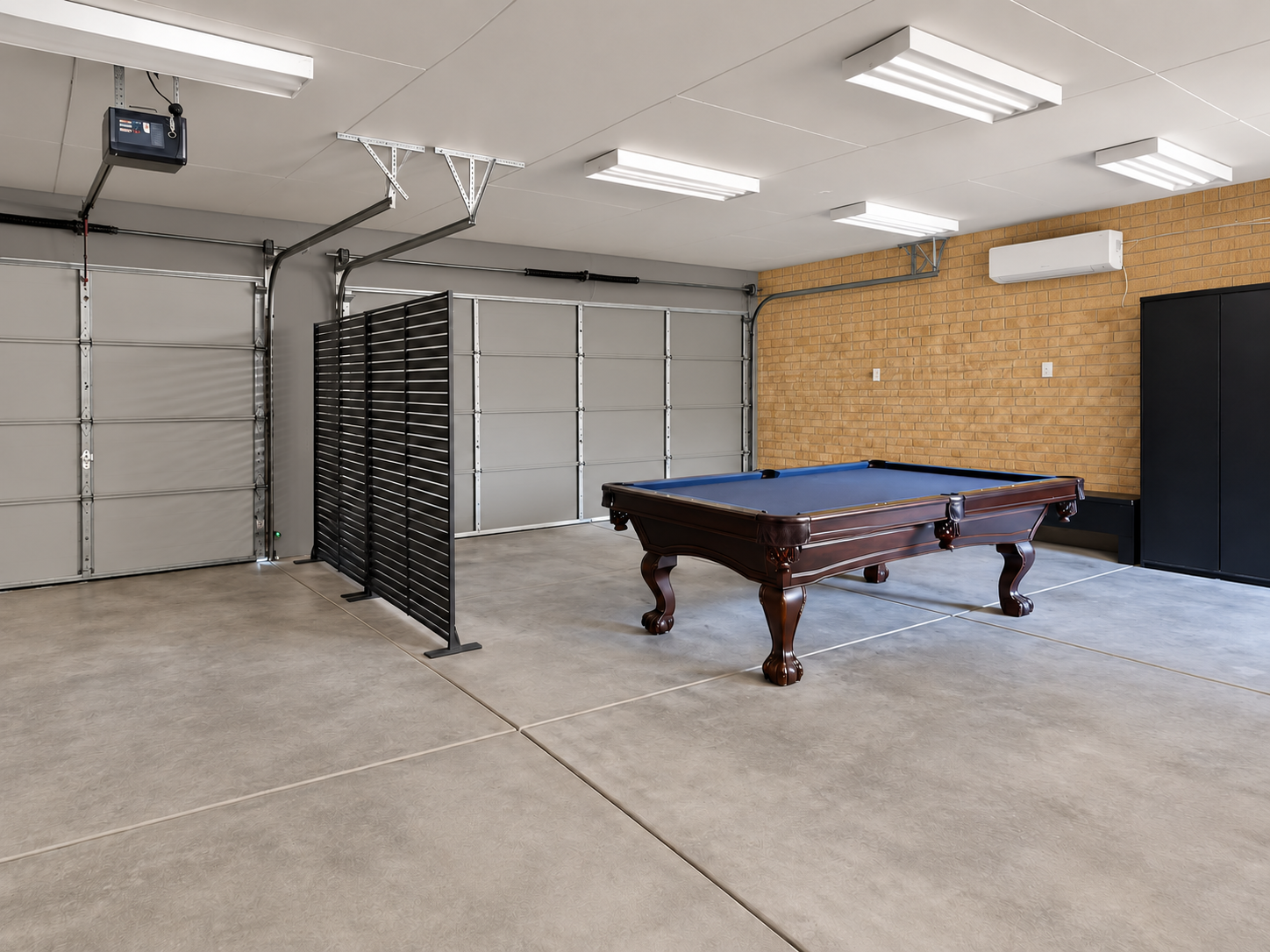 Spacious garage game room with pool table and plenty of flex space