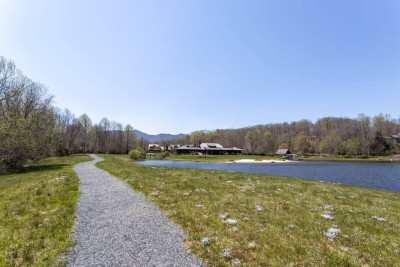 Follow this gently curving gravel path toward the community lakehouse and tranquil mountain lake. Take in the grassy shoreline, blooming wildflowers, and expansive High Country vistas.