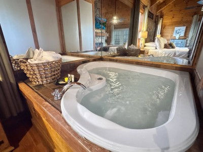 In-room jacuzzi soak at Red Rose Cabin in Sautee Nacoochee