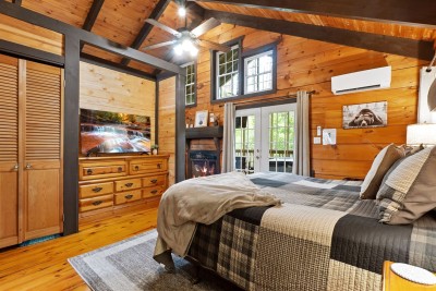 King bed steps from the screened porch at Honey Bee Cabin