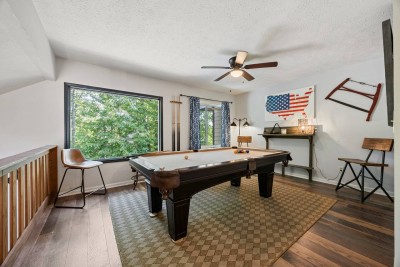 Game room with full-size pool table at Oben Retreat in Helen, GA