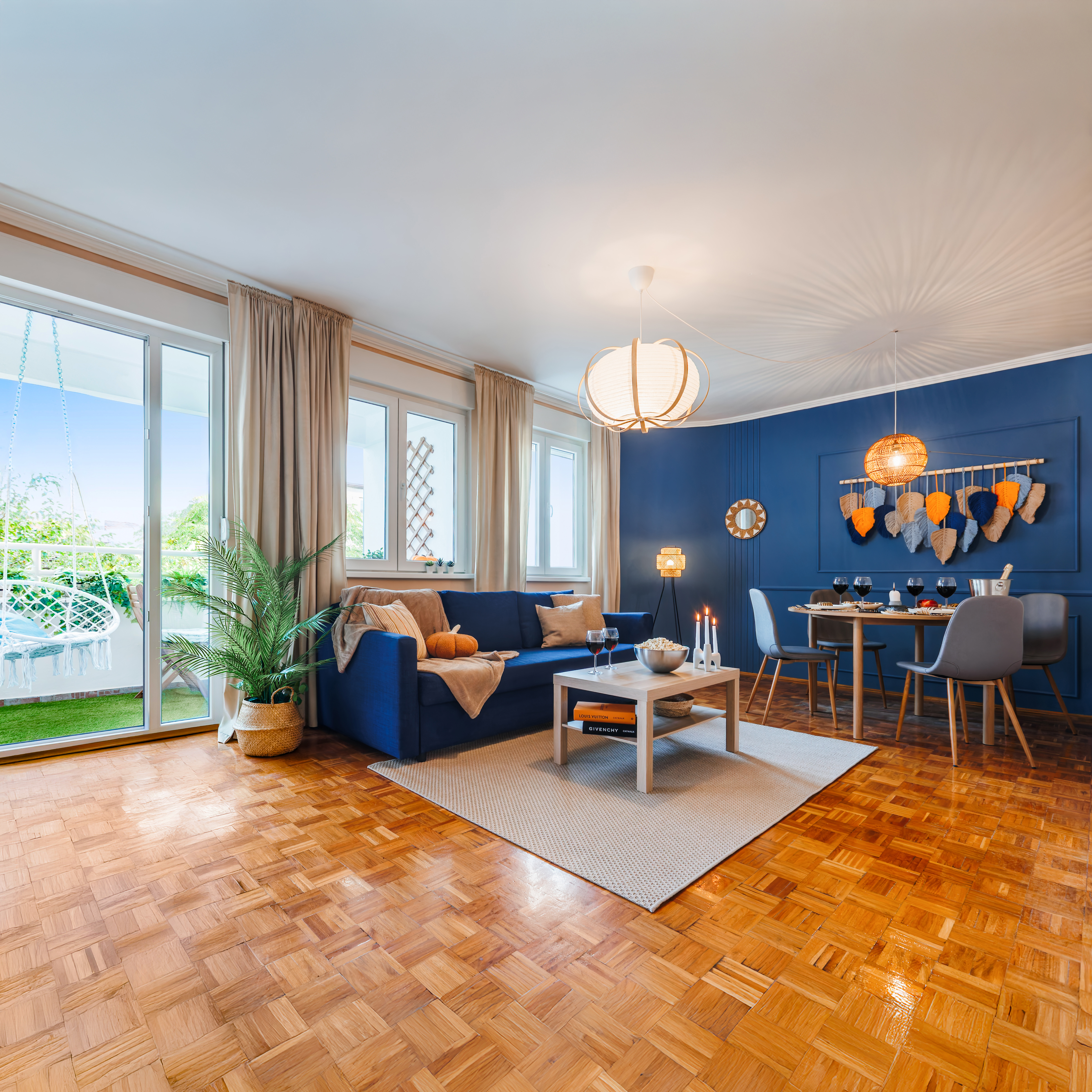 Bright open-plan lounge with balcony access and stylish modern dining area