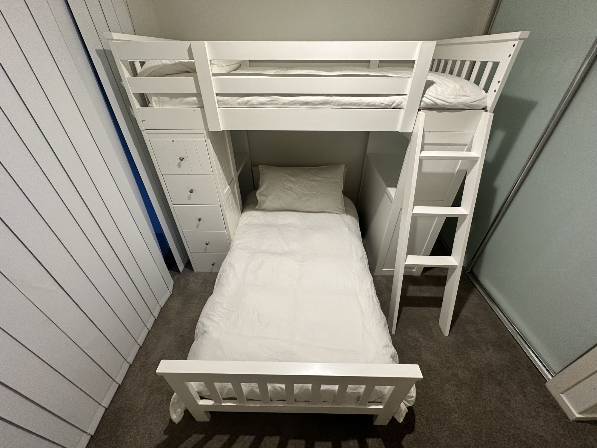 Space-saving bunk room with built-in storage for kids or extra guests