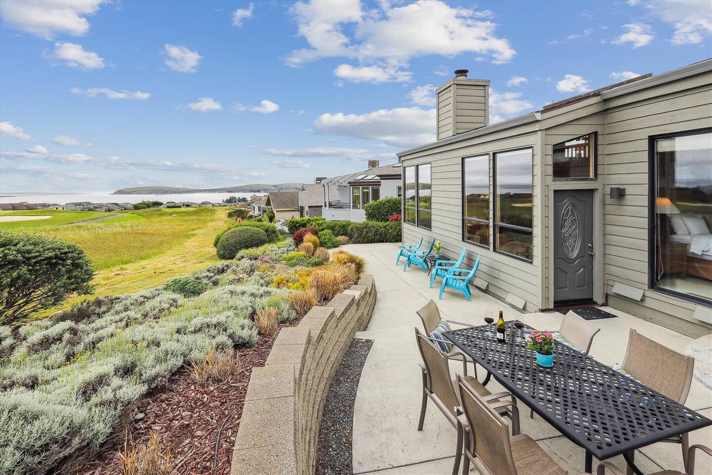 Spacious back deck with ample seating to dine al fresco or bask in the coastal sunshine.