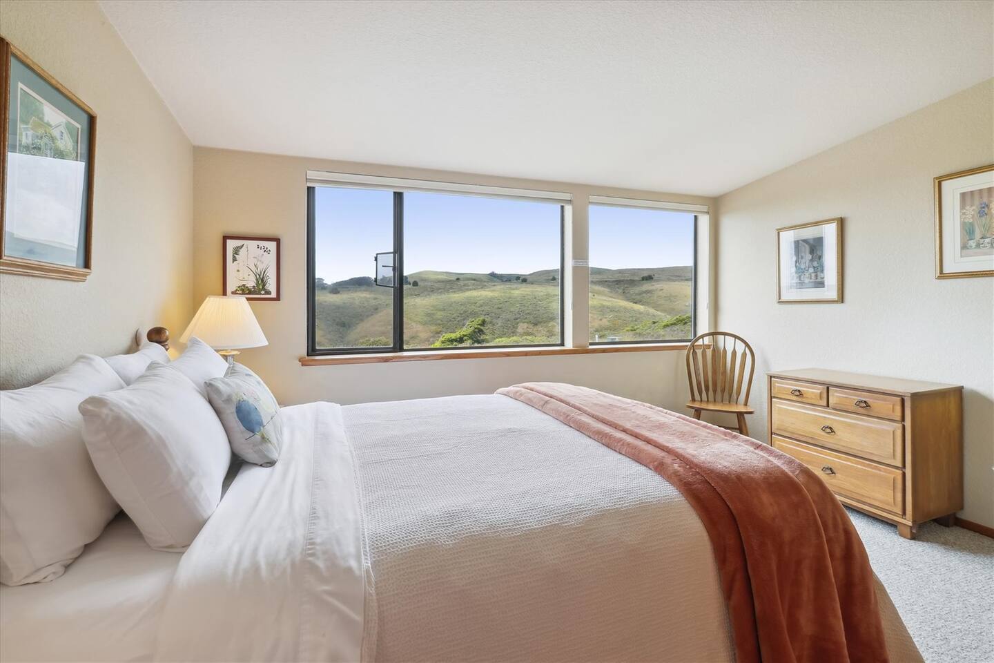 The upstairs Queen bedroom has a lovely view of the surrounding hills in front of the house.