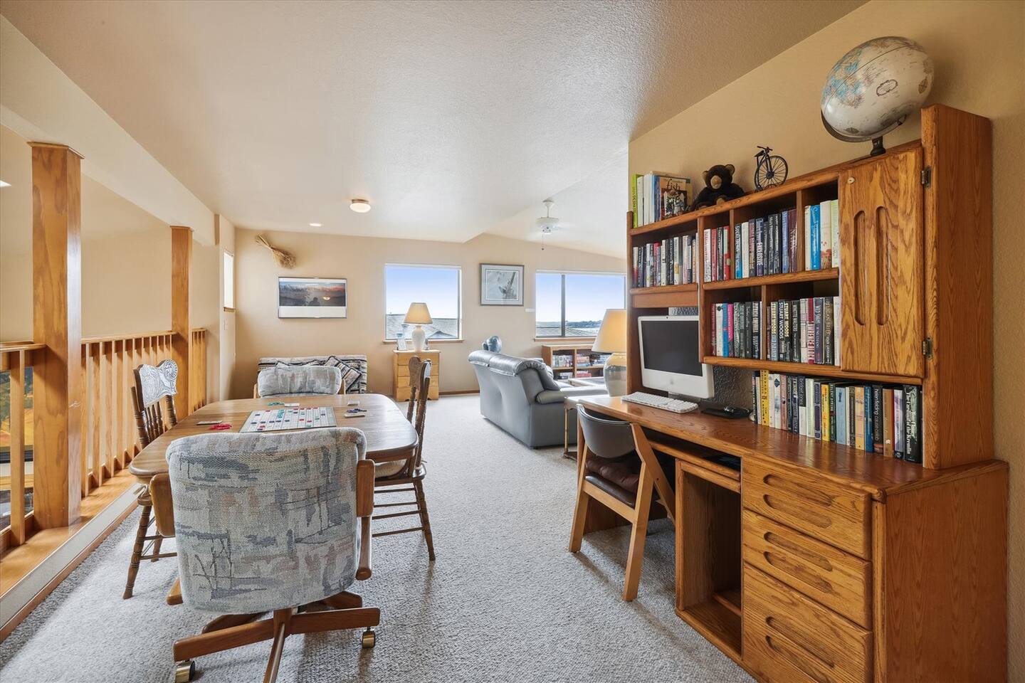 The loft has a game table, a large desk, and TV entertainment area. You will find a selection of games, puzzles, and books for your enjoyment. There is also a full-sized futon where children may sleep.