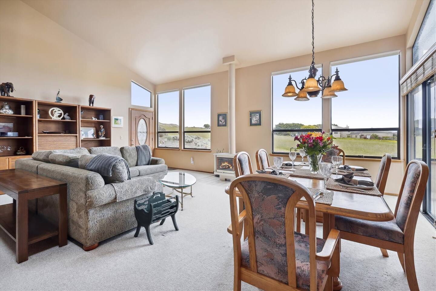 The dining area features large table with comfortable seating for 6, or for 8 with extra leaf.