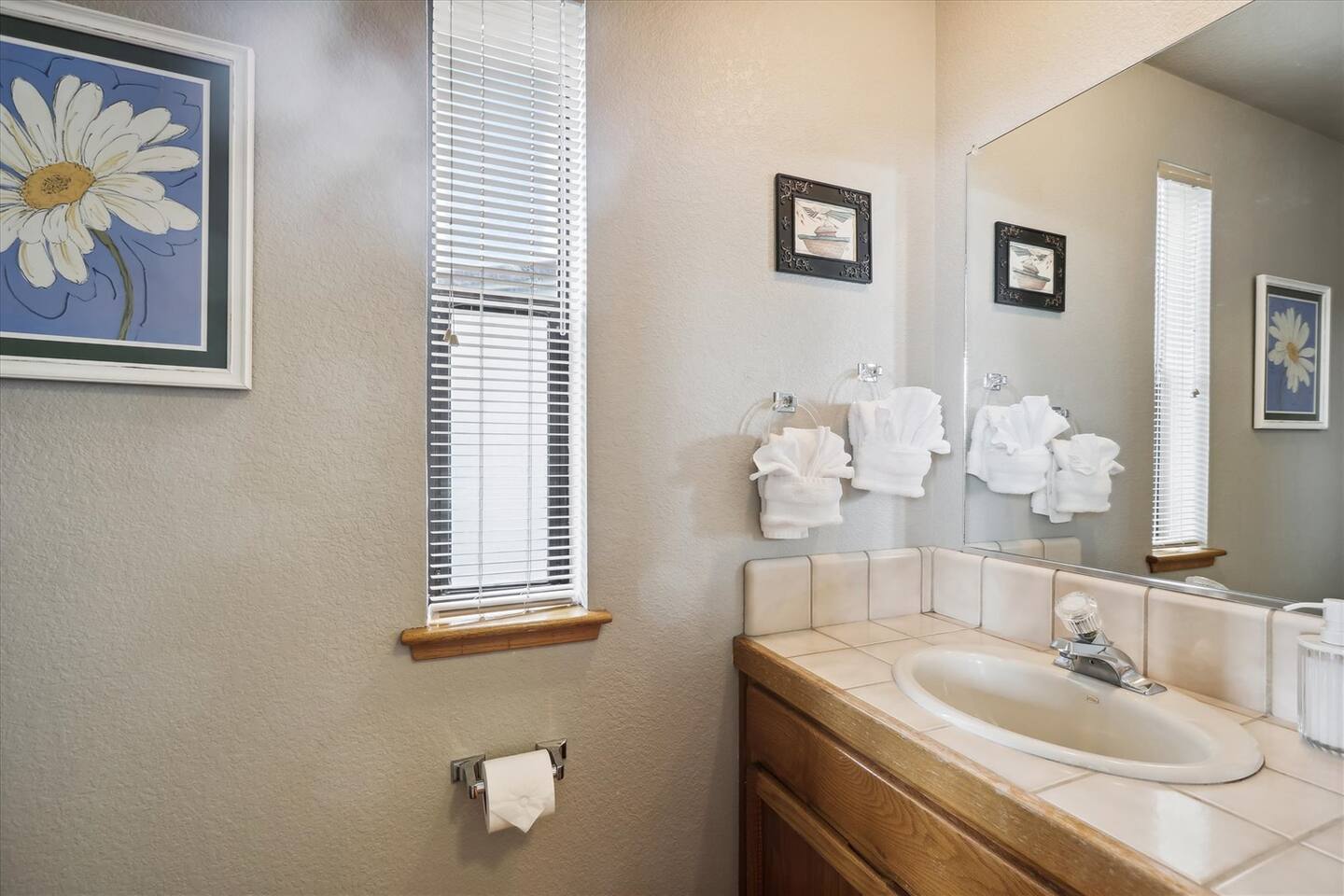 The half bathroom is conveniently close to the kitchen and dining room.