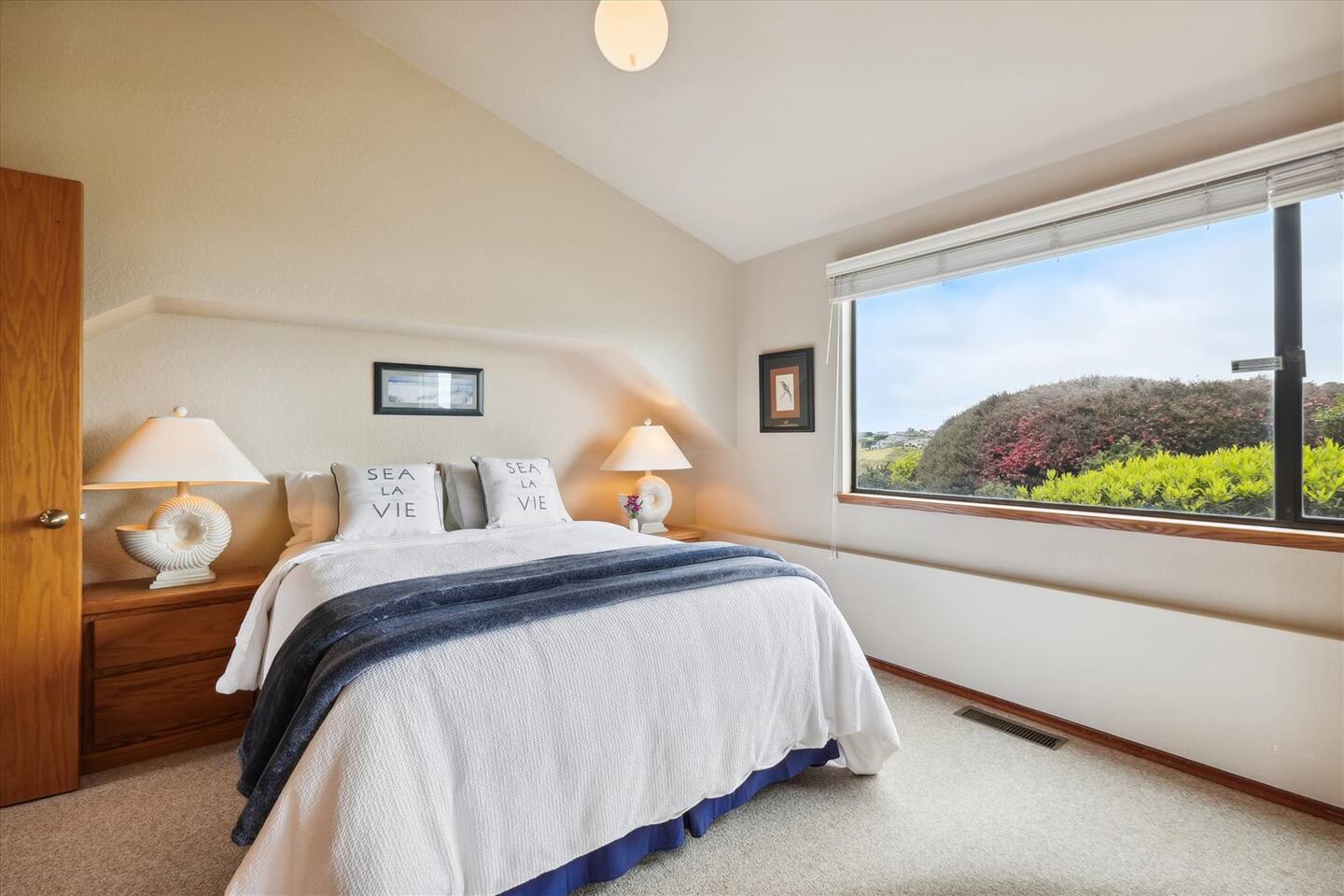 The downstairs bedroom has a Queen sized Simmons Beautyrest 800 Luxury Firm mattress, mirrored closet, and a view of the surrounding hills and open space.