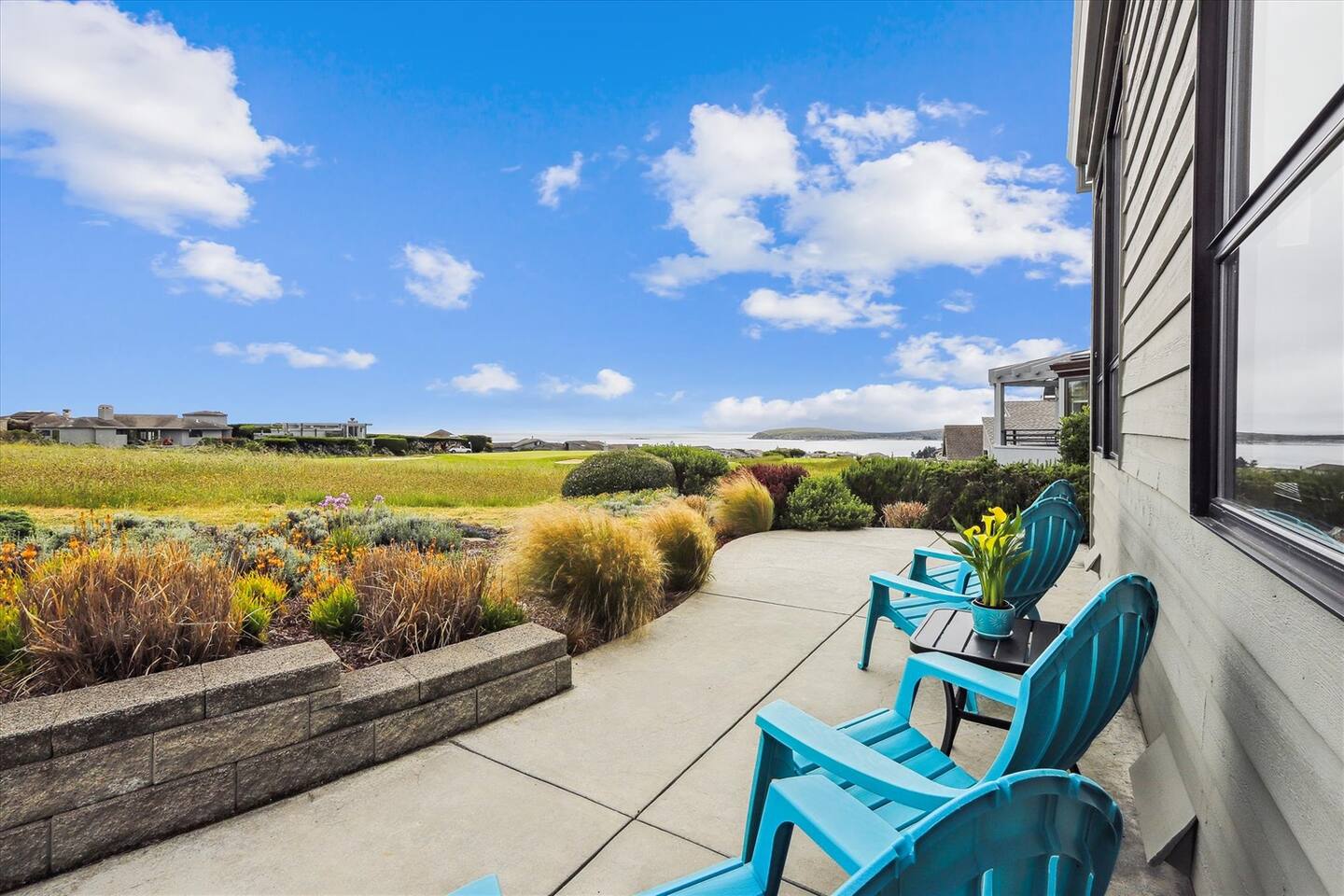 The back patio lets you bask in the sunshine at the 14th fairway with the ocean views beyond.