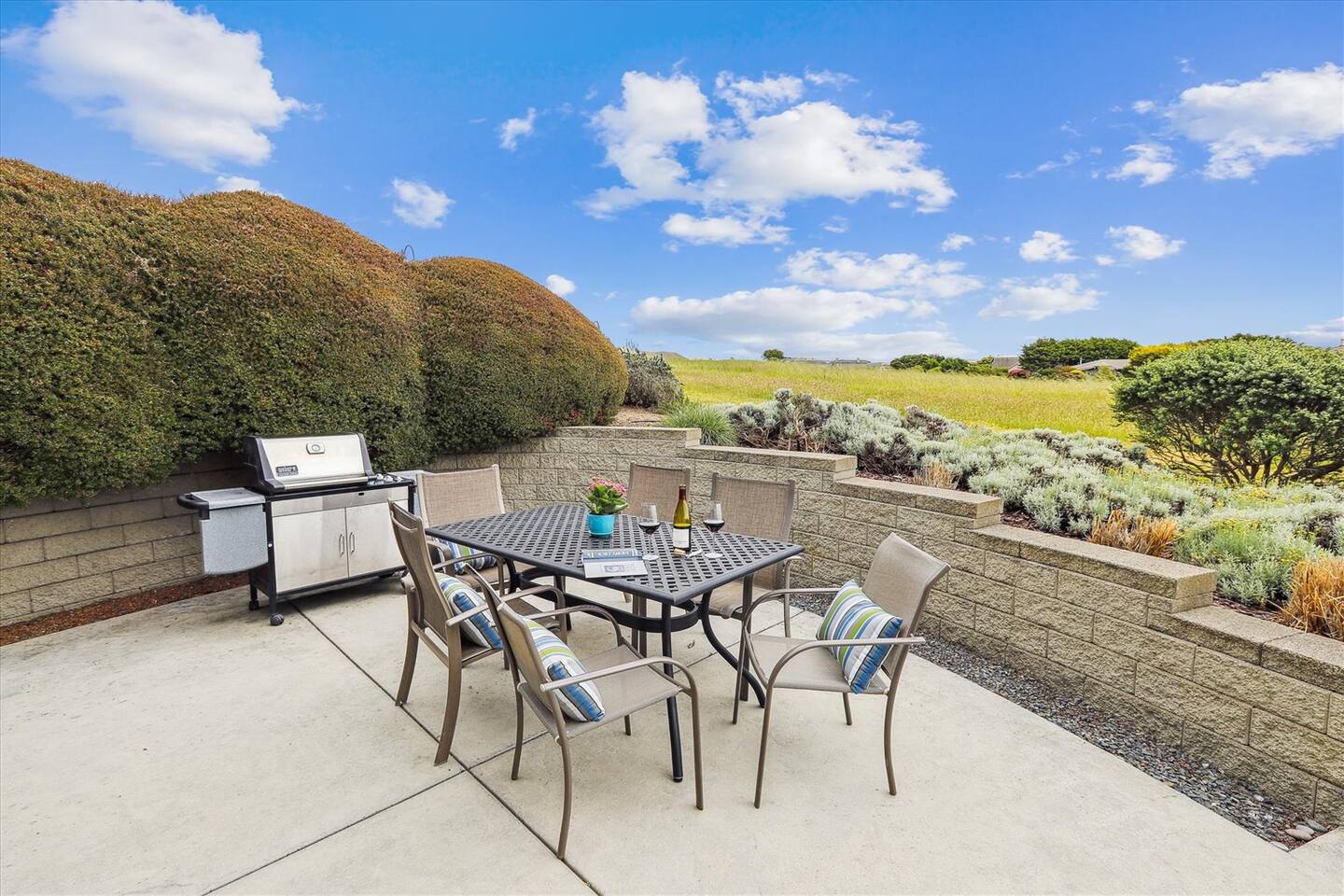 The backyard is set on the 14th fairway with spectacular ocean views and sunsets. Its the perfect place to grill out and enjoy an outdoor meal.