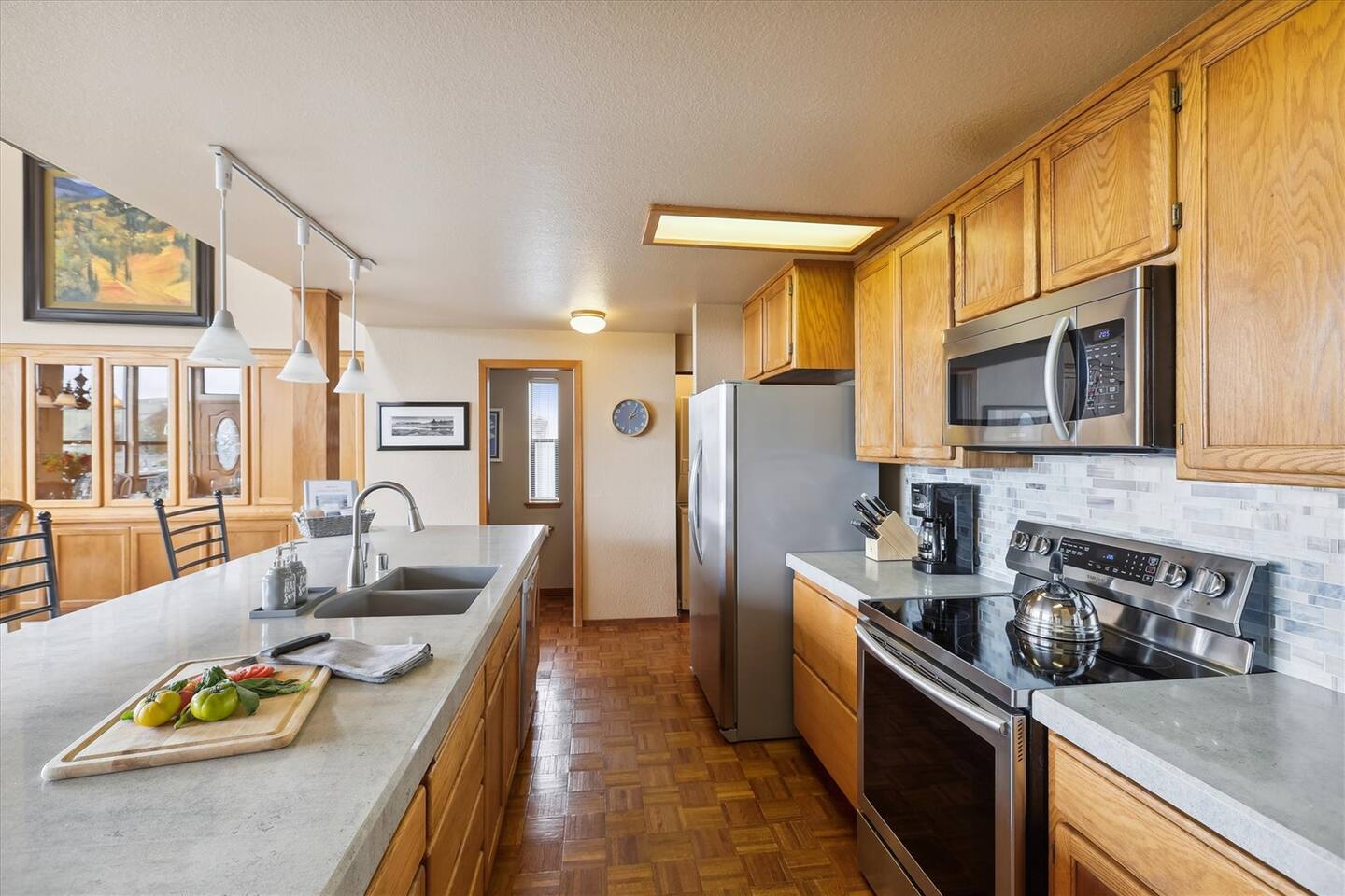 There is ample counter space in this well stocked kitchen.