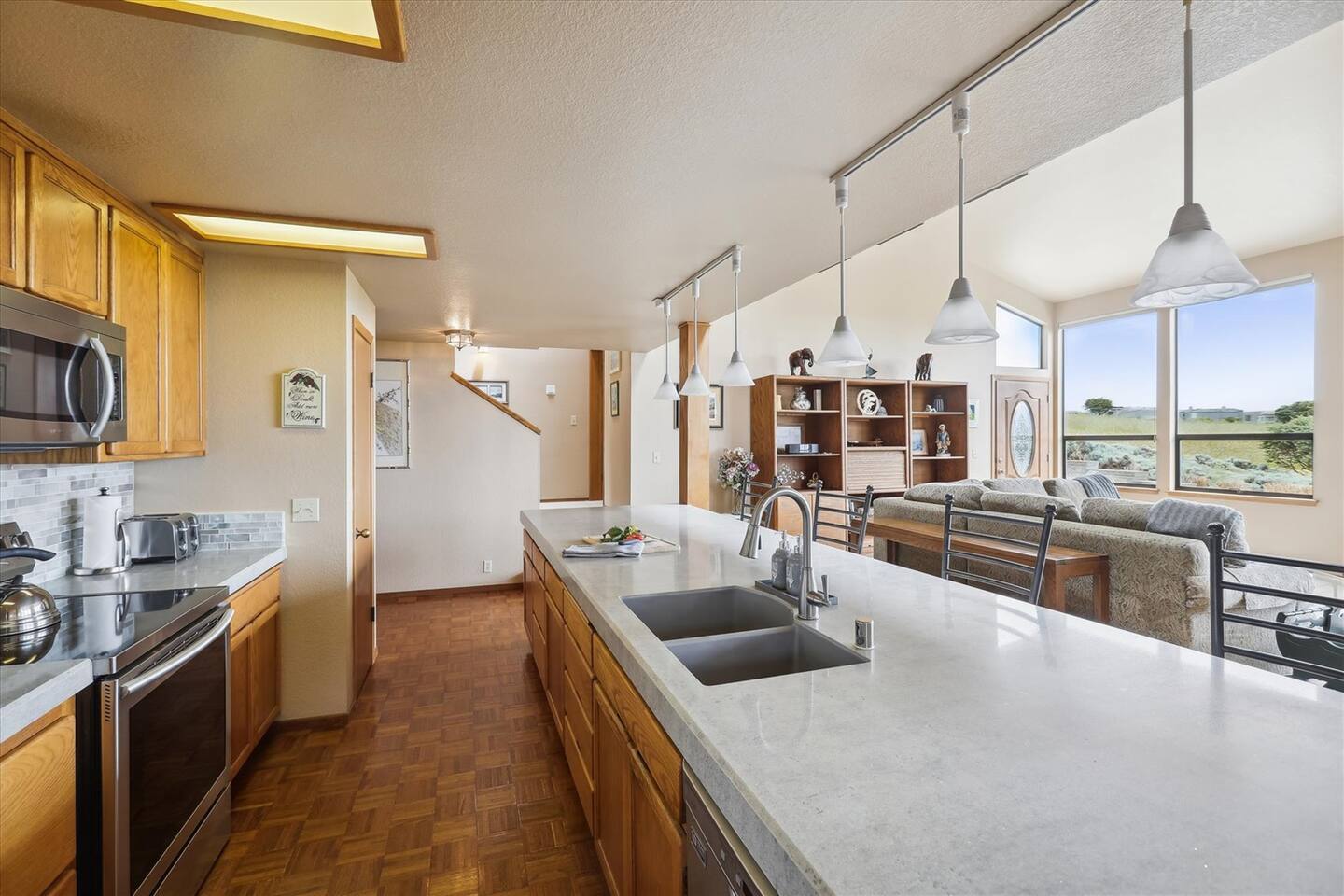 Fully equipped and recently updated kitchen with stainless steel appliances.