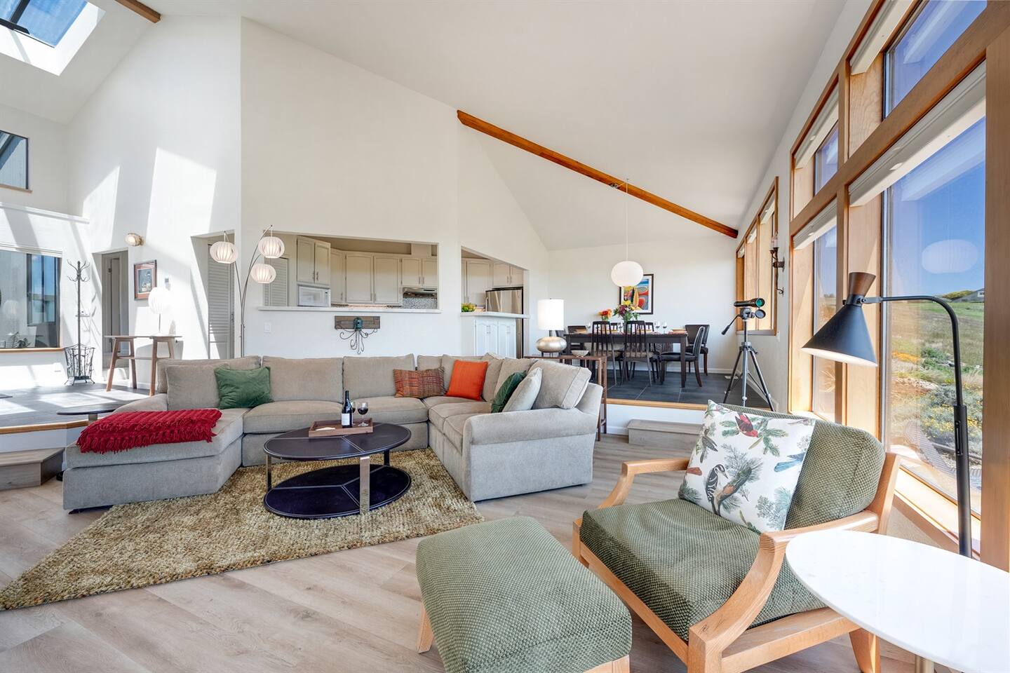 Bright and airy great room, naturally illuminated by the skylights and expansive windows