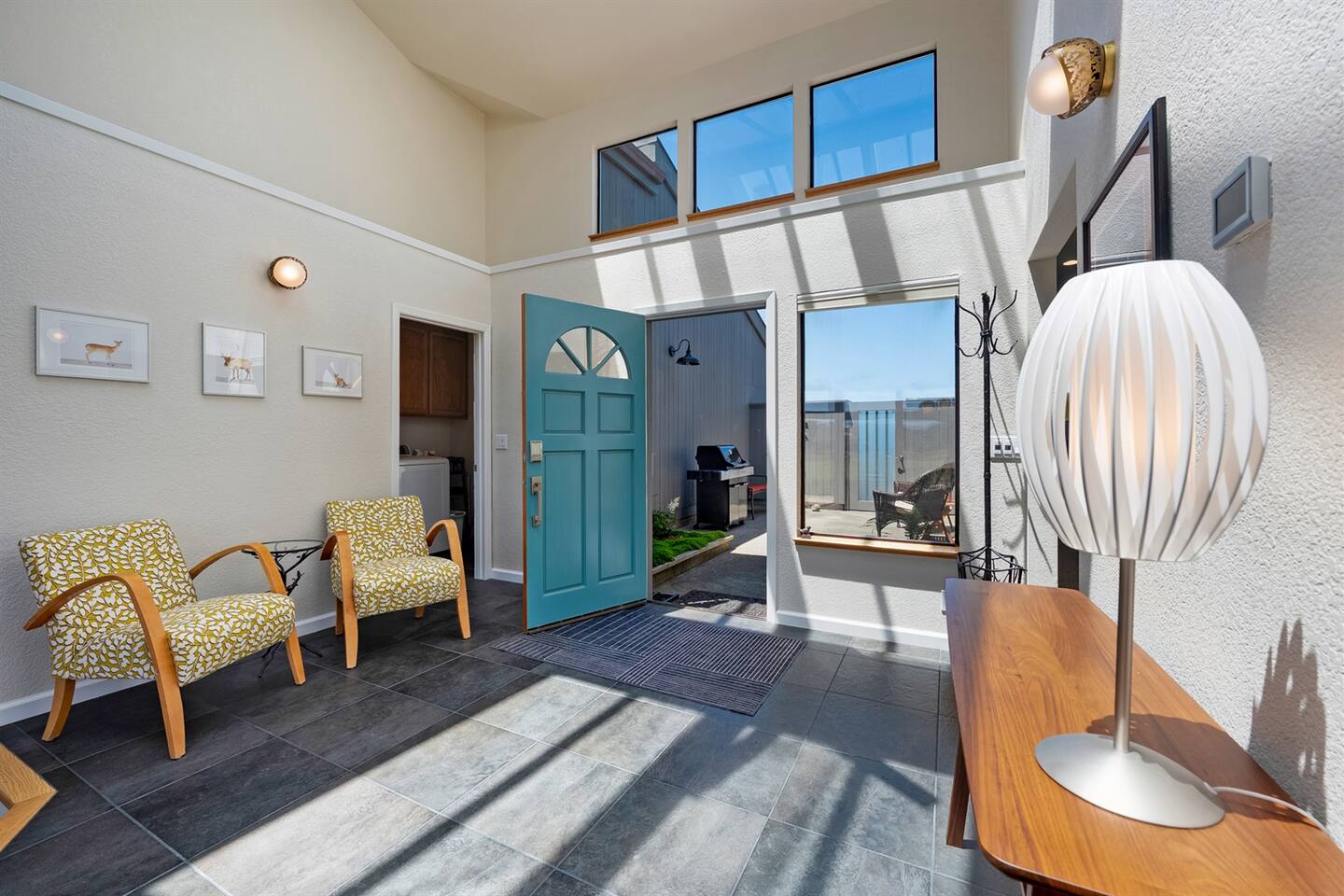 Welcoming entryway is illuminated by skylights above.