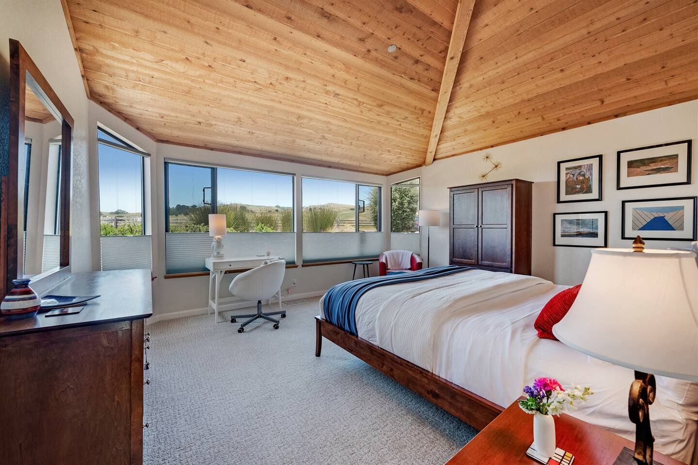 The front bedroom has and excellent views of the hillside, and a desk perfect as a remote work space.