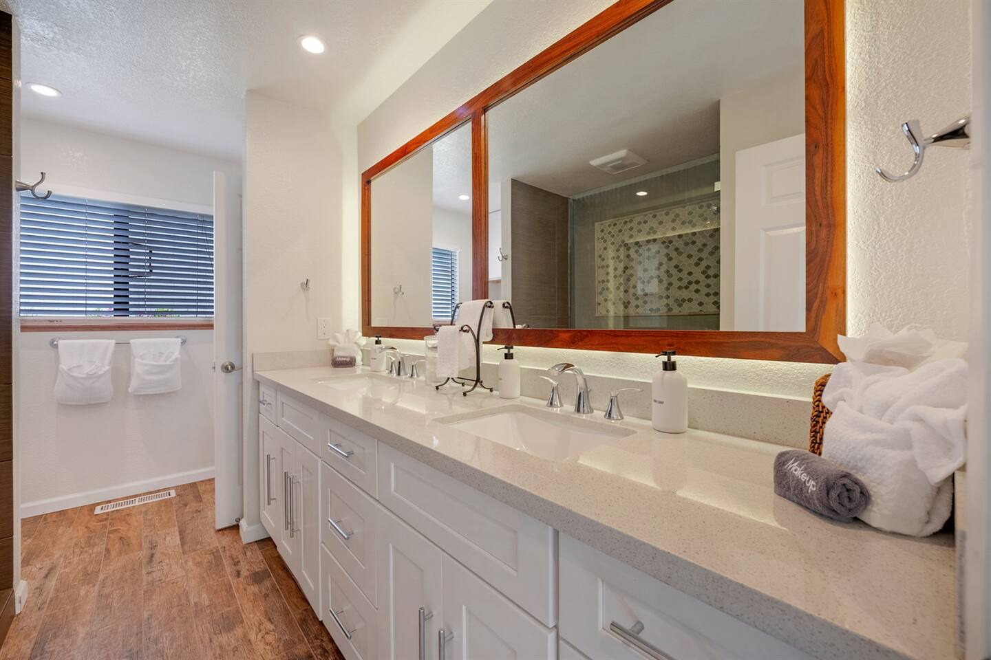 Recently remodeled hall bathroom with plenty of towels and amenities.