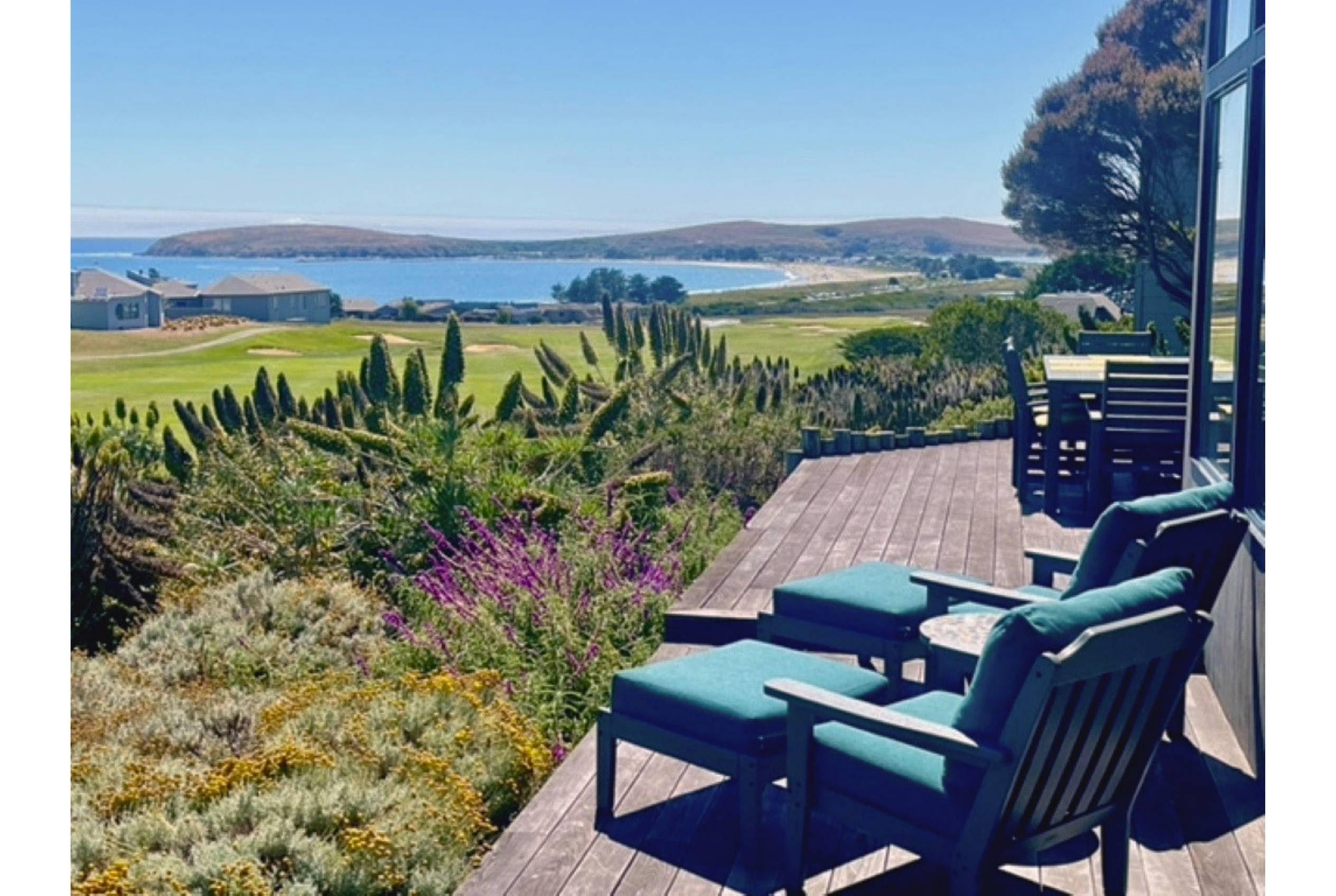 Scenic coastal-view deck with lounge seating and serene outdoor dining
