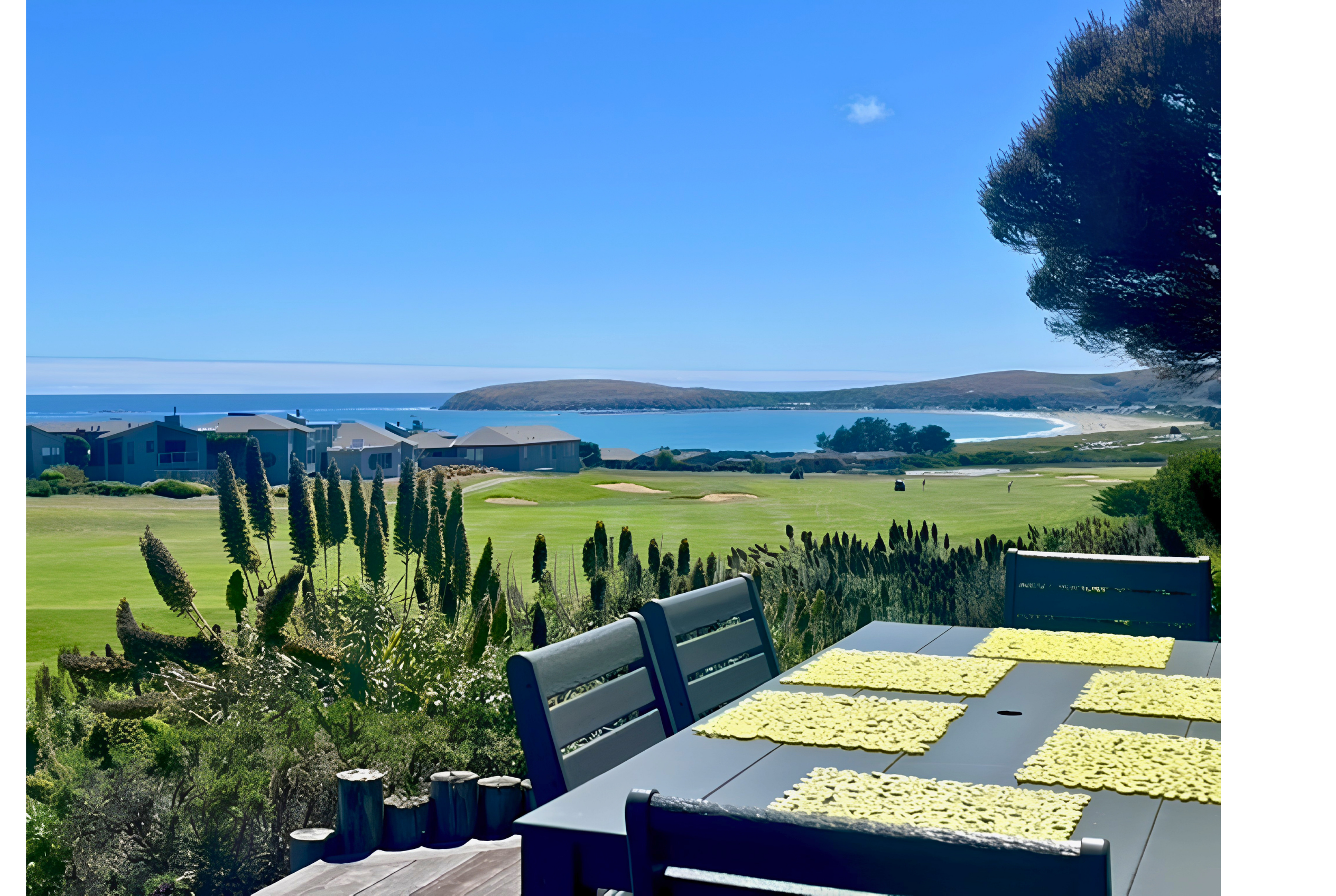Scenic outdoor dining with golf course and bay views