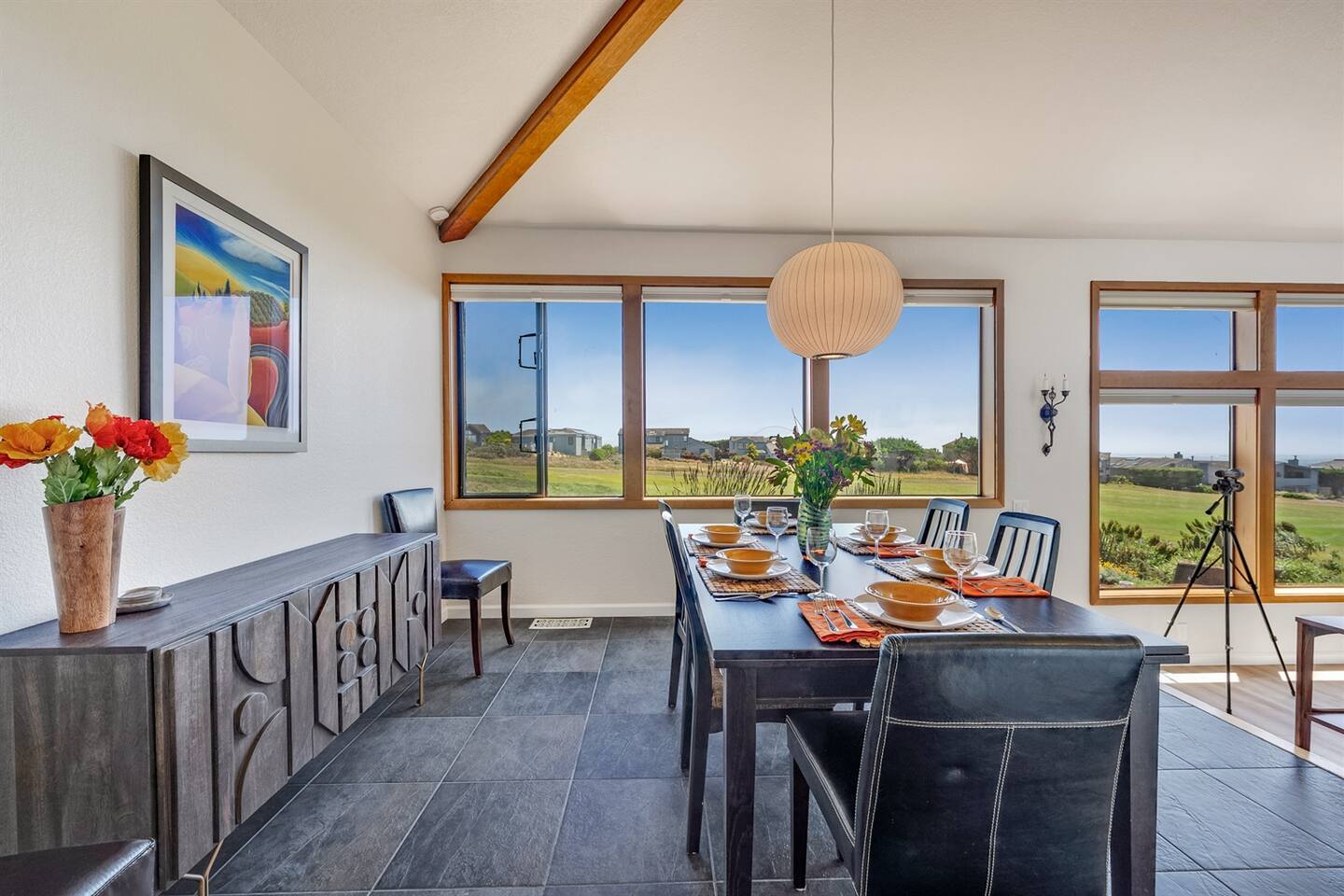 Dining room has a table that seats 6 people, but can be expanded to seat 8. Two additional chairs are against the wall..