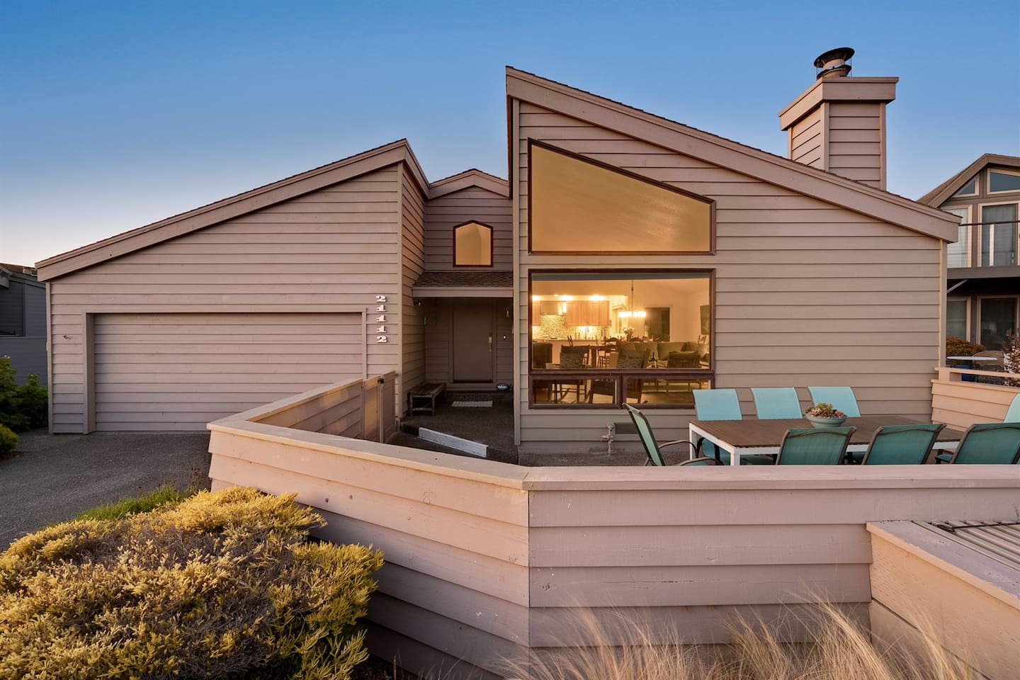Front of the home, illuminated by the sunset.