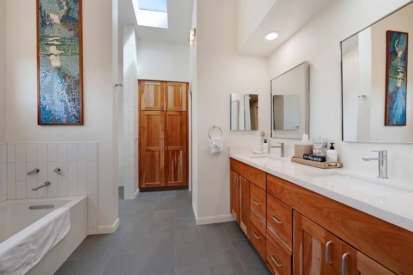 Primary bathroom with dual sinks. Luxurious cotton towels and quality amenities.