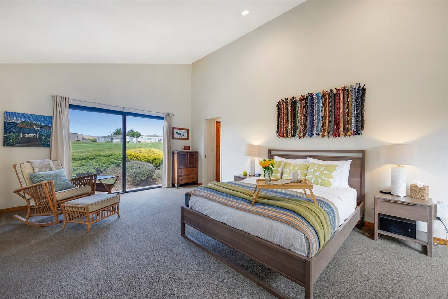 Large primary suite with a view of the 14th fairway of The Links golf course.