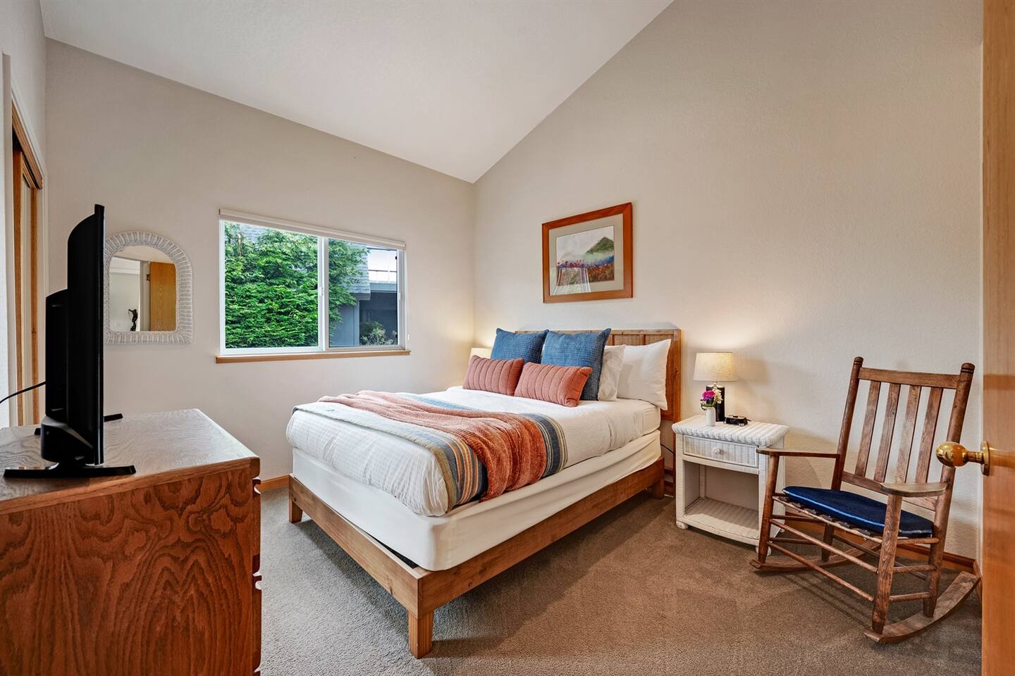 Secondary bedroom has a Queen bed and a Smart TV.