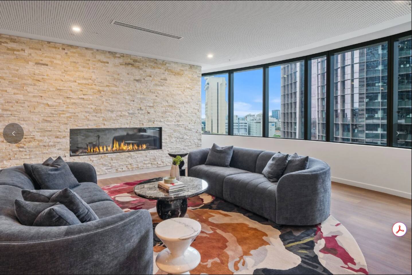 Common Area | Relax by the elegant fireplace and enjoy the city views.