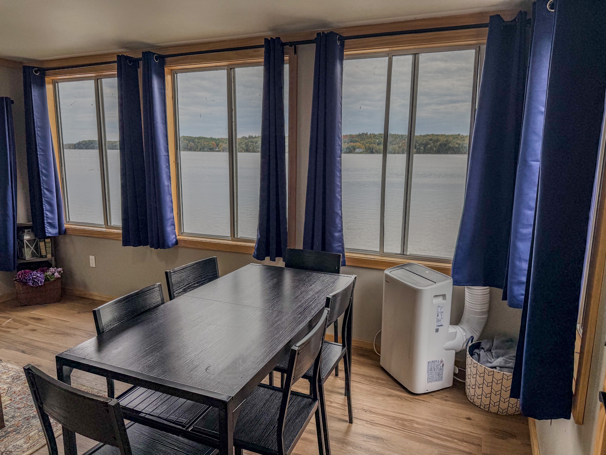 Dining for 6 with stunning lake views and bright natural light