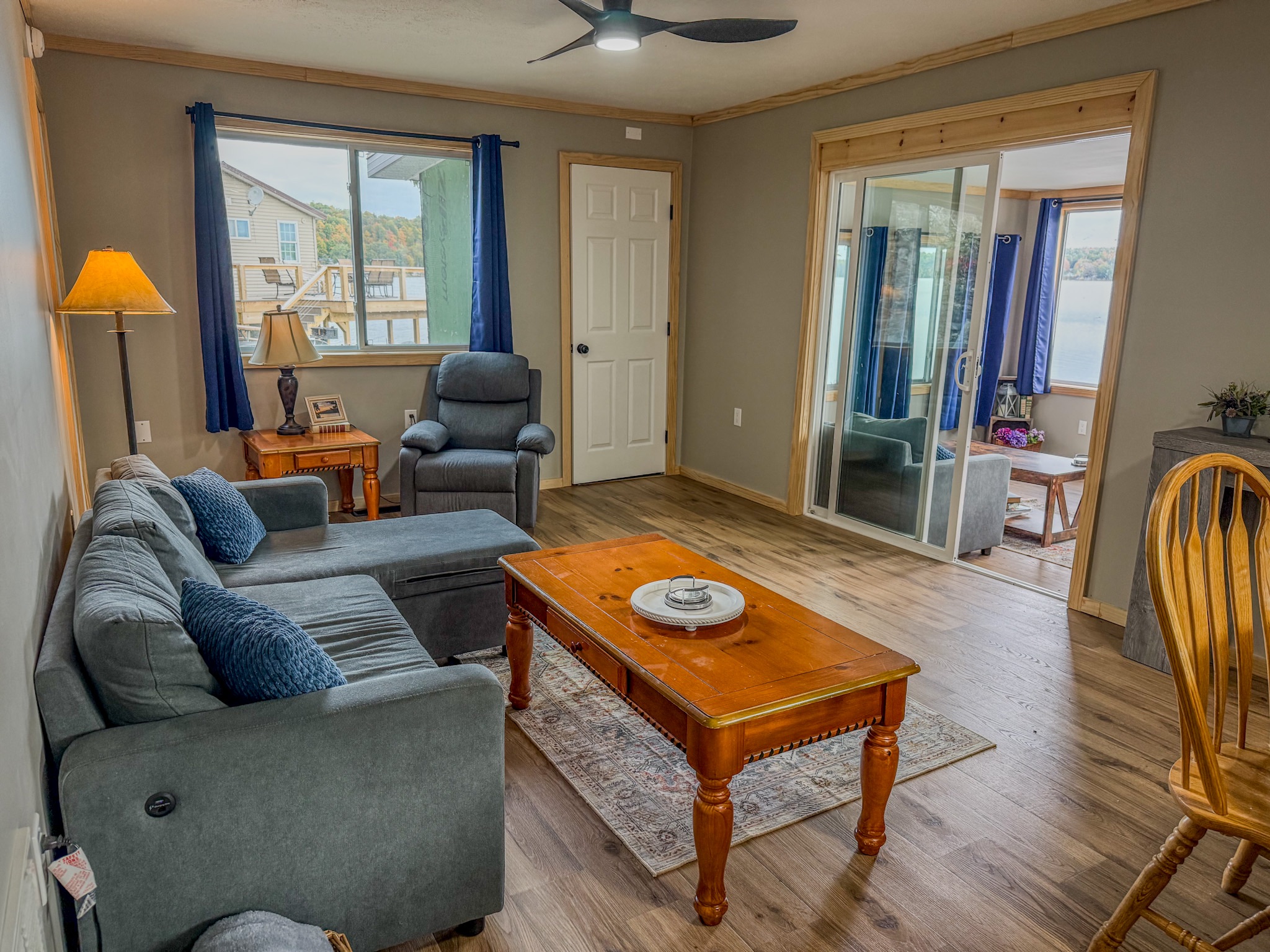 Cozy living room with sunroom access and plenty of natural light
