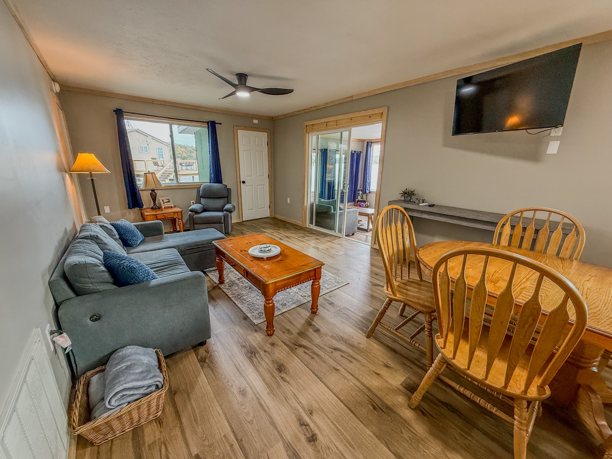 Bright open living space with dining area, TV, and cozy seating