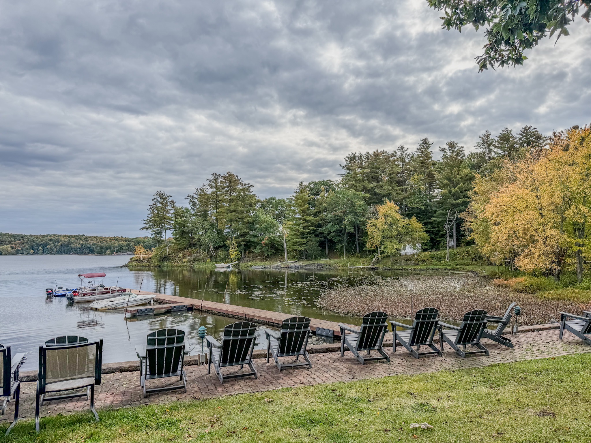 Private lakefront dock with Adirondack seating and peaceful water views