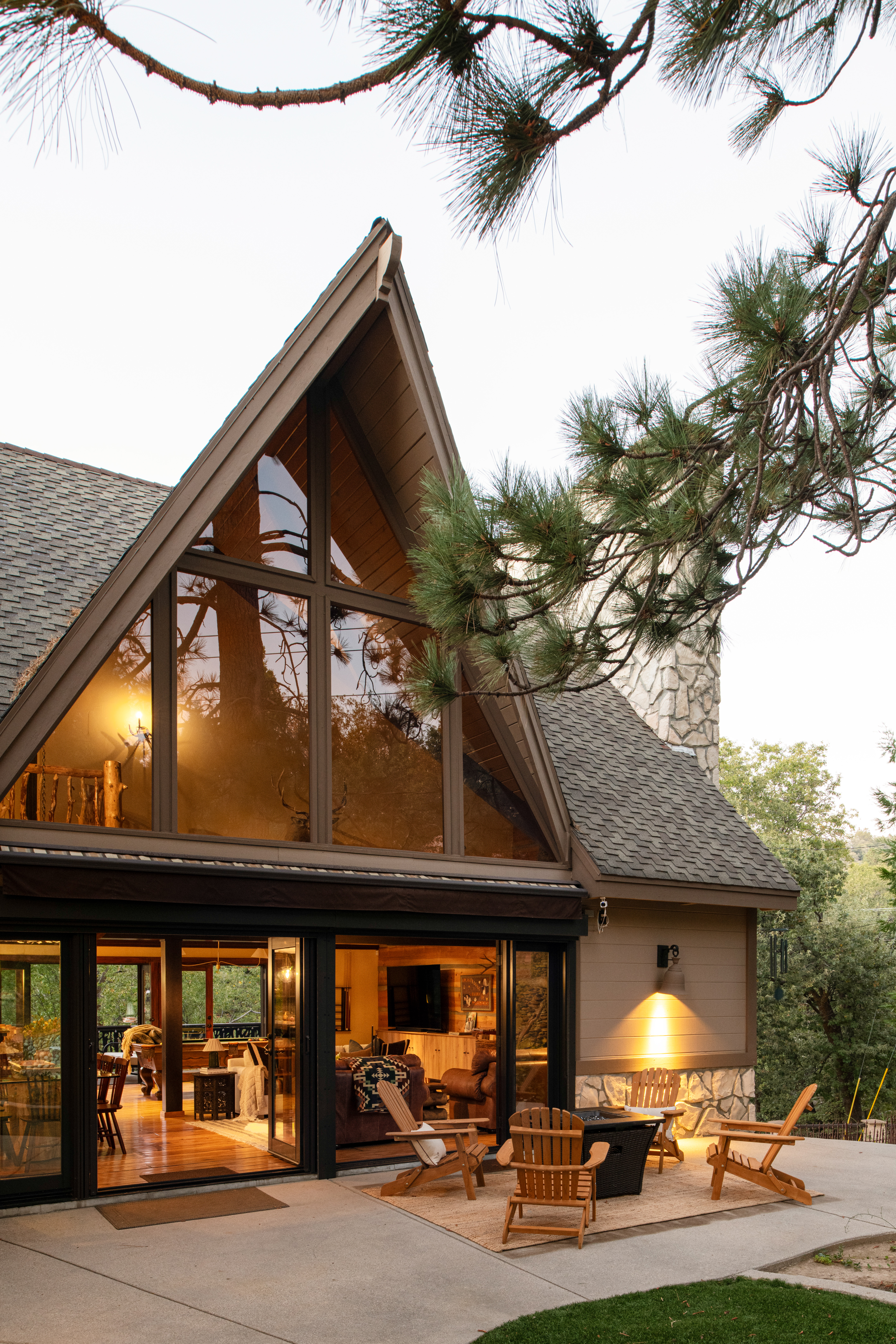 Charming A-frame retreat with patio fire pit and serene wooded views