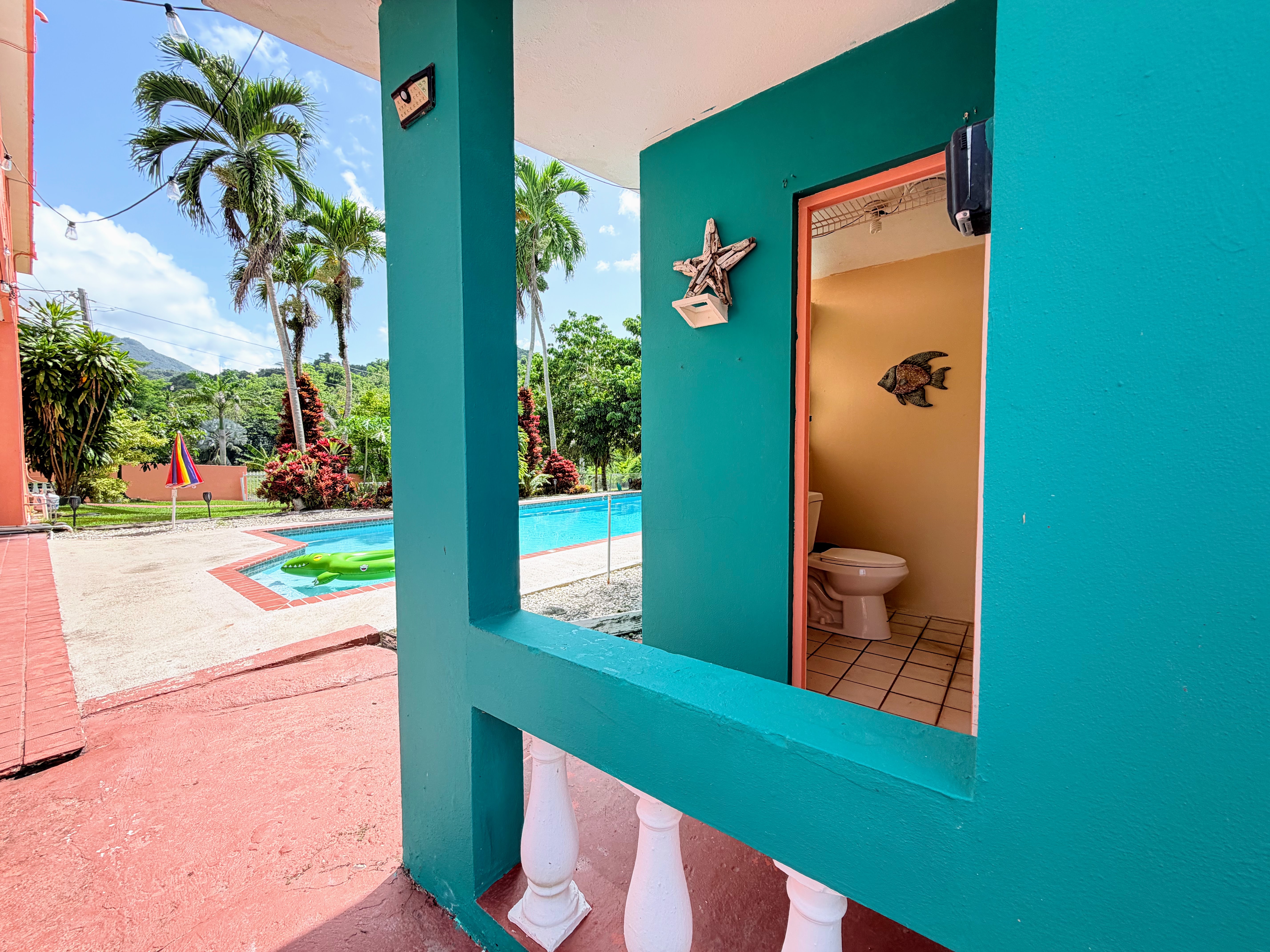 Tropical poolside oasis with convenient outdoor-access bathroom