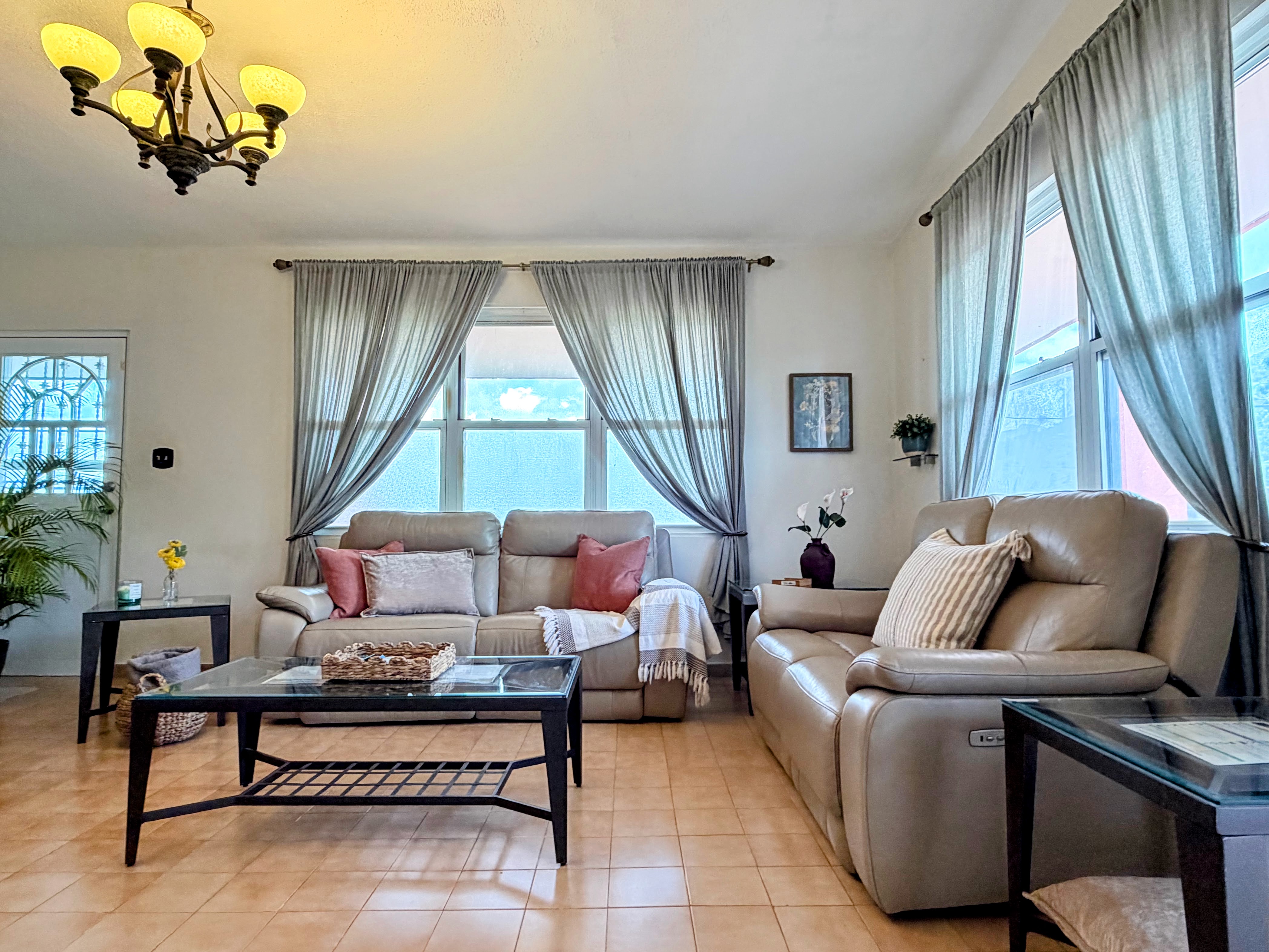Bright, stylish living room with plush seating and abundant natural light