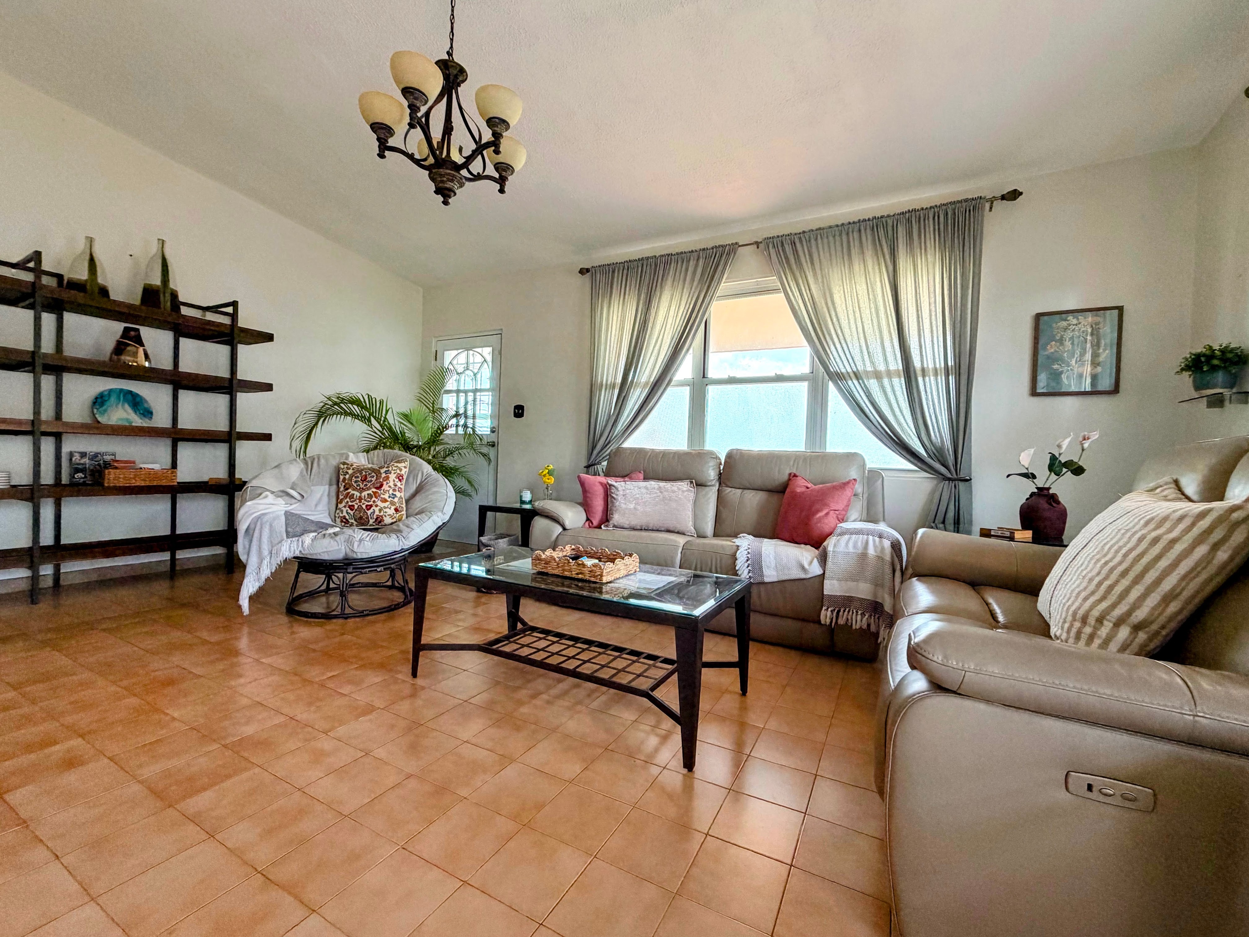 Bright, spacious living room with cozy seating and abundant natural light
