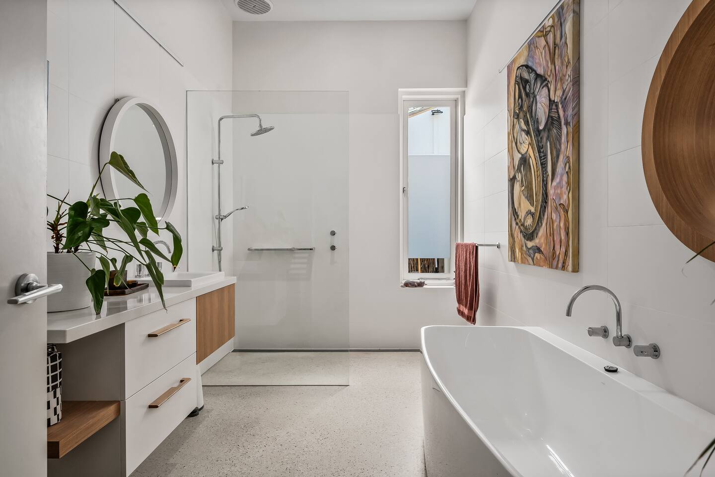 Free-standing bathtub and glass-walled shower with a spa-like feel