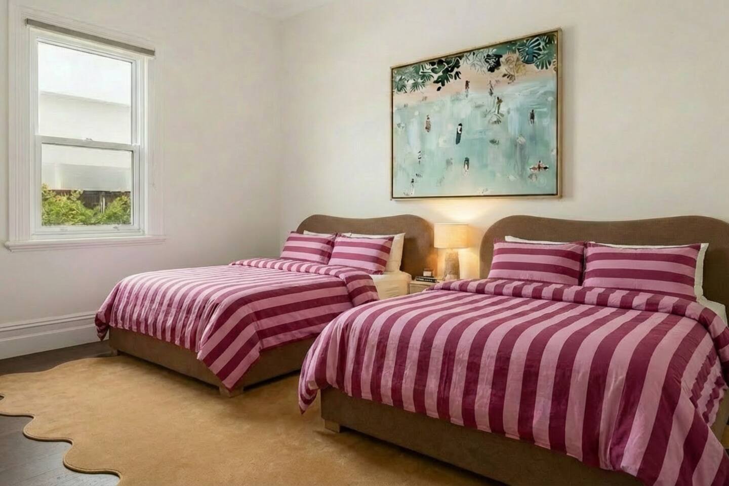 Two queen beds in restful neutral tones
