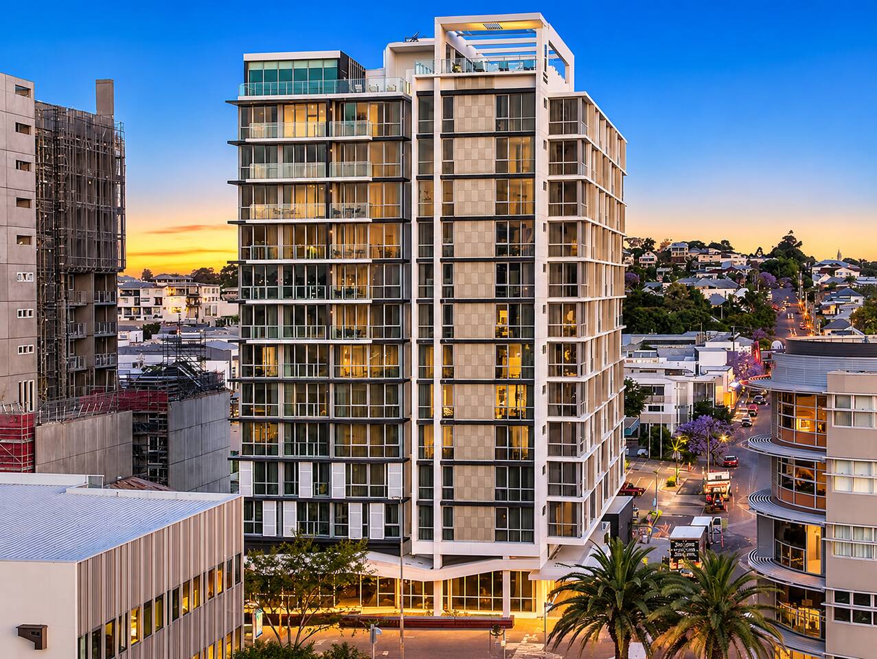 Exterior View: Stunning urban oasis with vibrant sunset views and modern architectural elegance!