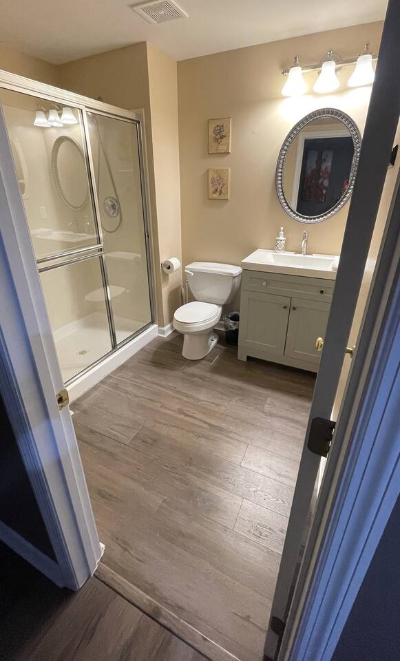Full bathroom with shampoo, conditioner, and body wash provided