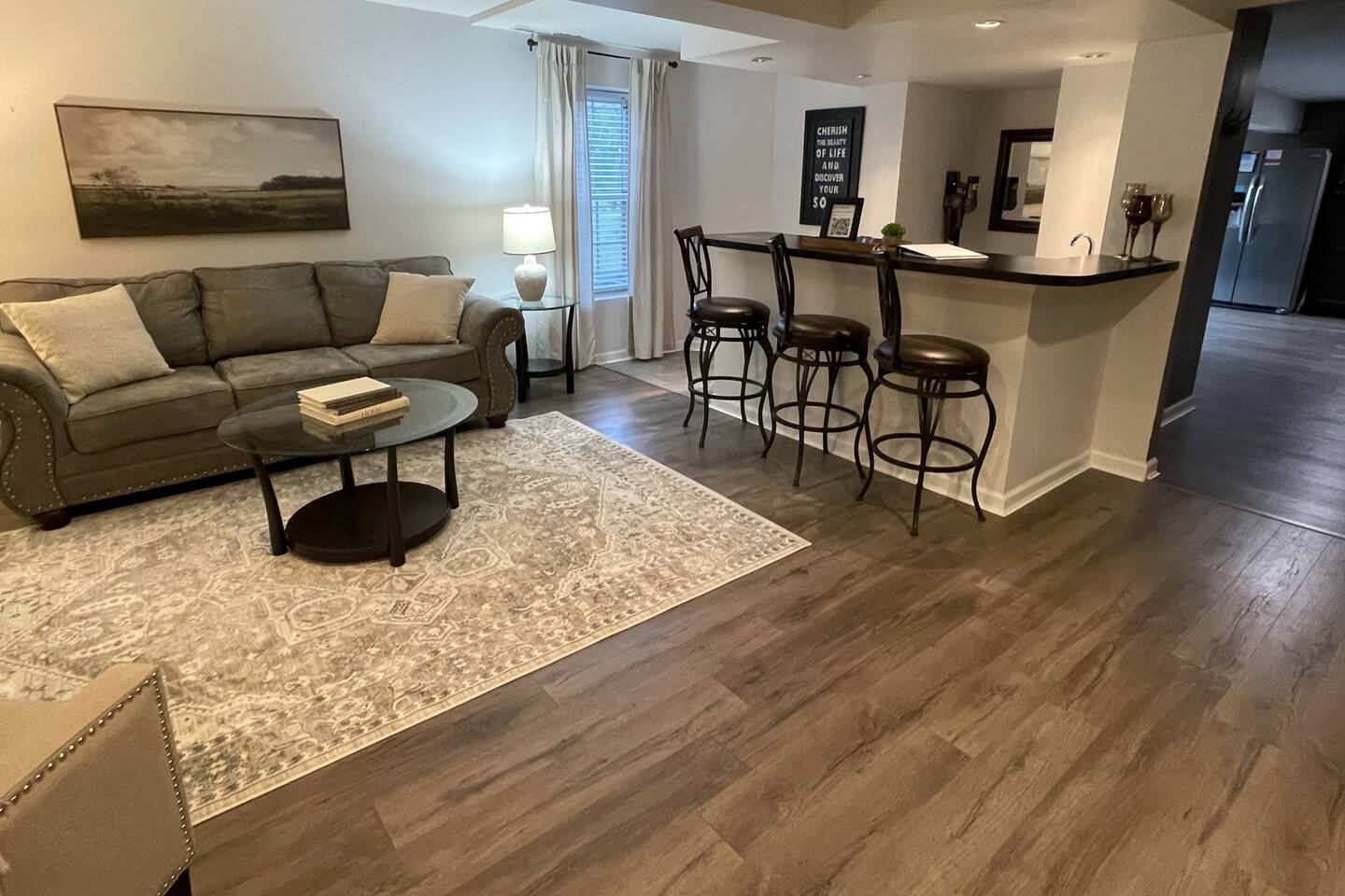 Spacious living room with bar and 65" smart TV