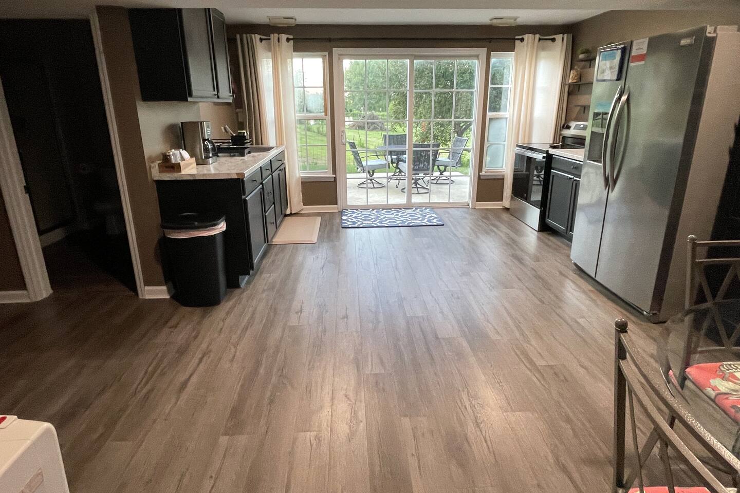 Oversized eat in kitchen leads out to patio area