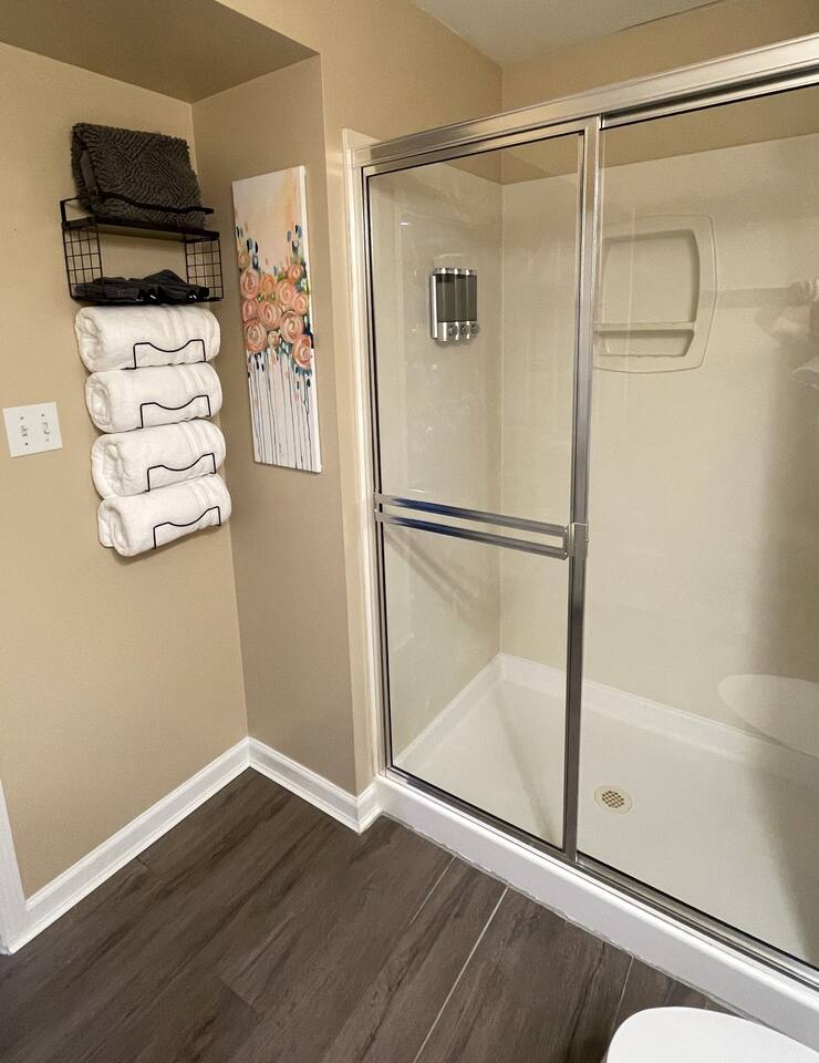Full bathroom with shampoo, conditioner, and body wash provided